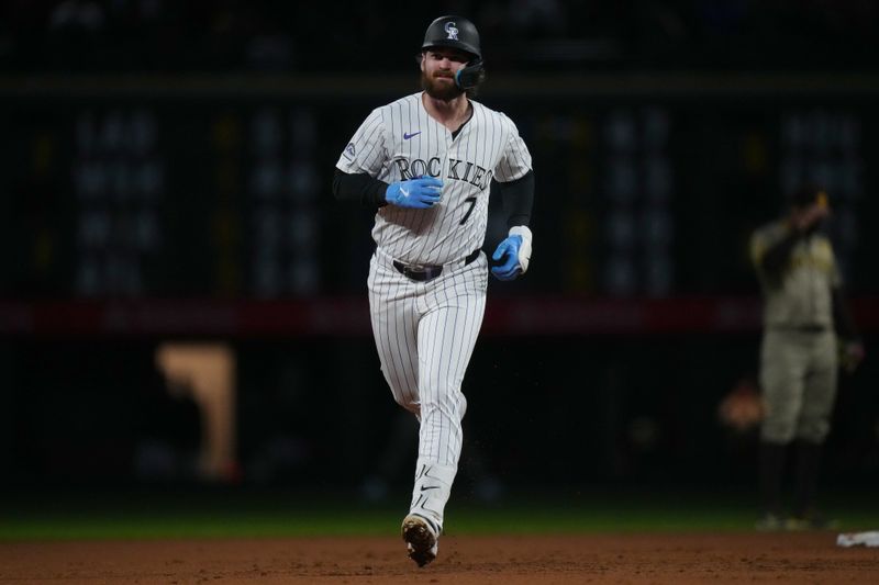 Apr 23, 2024; Denver, Colorado, USA; Colorado Rockies second base Brendan Rodgers (7) runs off a grand slam in the fourth inning against the San Diego Padres at Coors Field. Mandatory Credit: Ron Chenoy-USA TODAY Sports