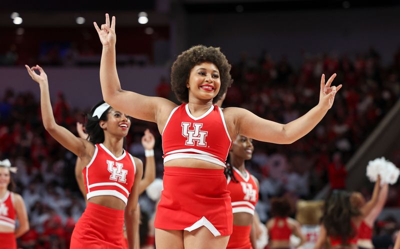 Feb 19, 2024; Houston, Texas, USA; Houston Cougars cheerleaders perform during the game against the Iowa State Cyclones at Fertitta Center. Mandatory Credit: Troy Taormina-USA TODAY Sports