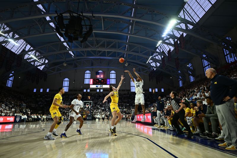 Jan 7, 2024; Philadelphia, Pennsylvania, USA; Penn State Nittany Lions forward Zach Hicks (24) shoots against Michigan Wolverines forward Will Tschetter (42) in the first half at The Palestra. Mandatory Credit: Kyle Ross-USA TODAY Sports