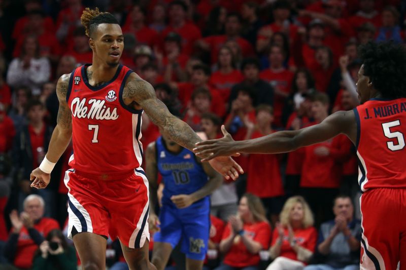 Dec 2, 2023; Oxford, Mississippi, USA; Mississippi Rebels guard Allen Flanigan (7) reacts with guard Jaylen Murray (5) during the first half against the Memphis Tigers at The Sandy and John Black Pavilion at Ole Miss. Mandatory Credit: Petre Thomas-USA TODAY Sports