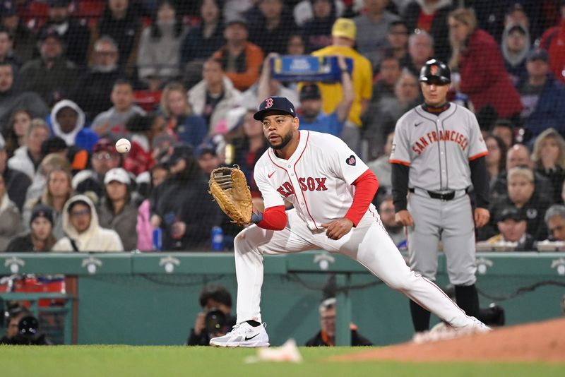 May 1, 2024; Boston, Massachusetts, USA; Boston Red Sox first baseman Dominic Smith (2) makes a catch for an out against the San Francisco Giants during the fifth inning at Fenway Park. Mandatory Credit: Eric Canha-USA TODAY Sports