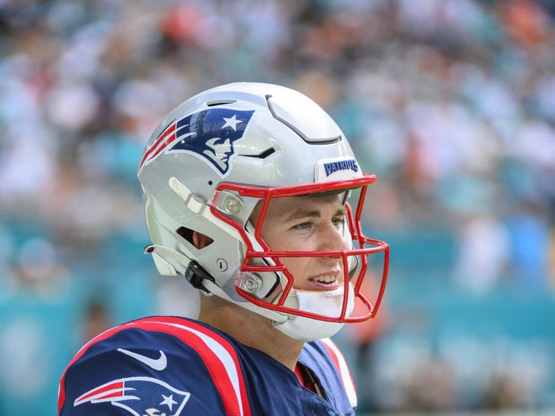 New England Patriots quarterback Mac Jones (10) warms up on the field during an NFL football game against the Miami Dolphins, Sunday, Oct. 29, 2023, in Miami Gardens, Fla. (AP Photo/Doug Murray)