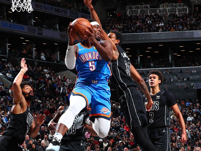 BROOKLYN, NY - JANUARY 5: Luguentz Dort #5 of the Oklahoma City Thunder goes to the basket during the game on January 5, 2024 at Barclays Center in Brooklyn, New York. NOTE TO USER: User expressly acknowledges and agrees that, by downloading and or using this Photograph, user is consenting to the terms and conditions of the Getty Images License Agreement. Mandatory Copyright Notice: Copyright 2024 NBAE (Photo by David L. Nemec/NBAE via Getty Images)