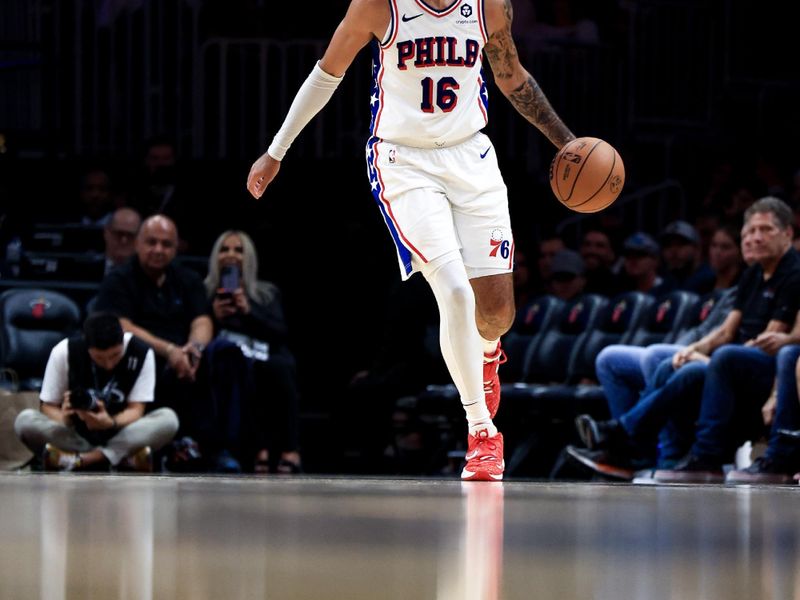 MIAMI, FLORIDA - NOVEMBER 18: Caleb Martin #16 of the Philadelphia 76ers controls the ball against the Miami Heat during the second half at Kaseya Center on November 18, 2024 in Miami, Florida. NOTE TO USER: User expressly acknowledges and agrees that, by downloading and or using this Photograph, user is consenting to the terms and conditions of the Getty Images License Agreement.  (Photo by Carmen Mandato/Getty Images)