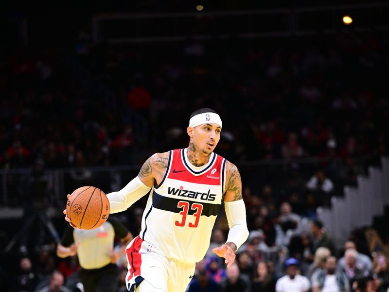 ATLANTA, GA - NOVEMBER 15:  Kyle Kuzma #33 of the Washington Wizards dribbles the ball during the game against the Atlanta Hawks during the Emirates NBA Cup game on November 15, 2024 at State Farm Arena in Atlanta, Georgia.  NOTE TO USER: User expressly acknowledges and agrees that, by downloading and/or using this Photograph, user is consenting to the terms and conditions of the Getty Images License Agreement. Mandatory Copyright Notice: Copyright 2024 NBAE (Photo by Adam Hagy/NBAE via Getty Images)