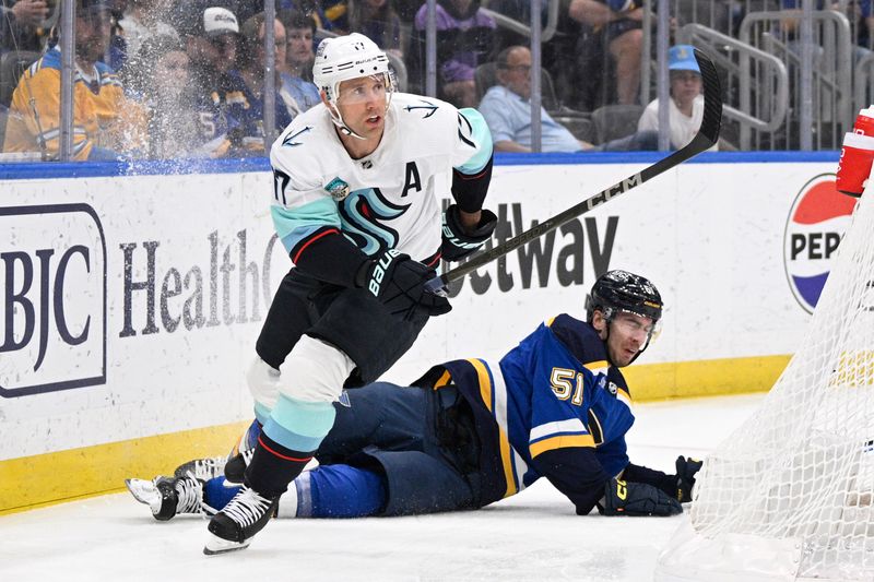 Apr 14, 2024; St. Louis, Missouri, USA; Seattle Kraken center Jaden Schwartz (17) collides with St. Louis Blues defenseman Matthew Kessel (51) during the first period at Enterprise Center. Mandatory Credit: Jeff Le-USA TODAY Sports