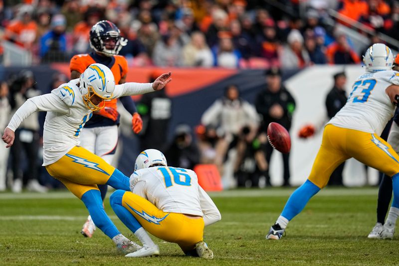 Los Angeles Chargers place kicker Cameron Dicker (11) kicks a field goal against the Denver Broncos during the second half of an NFL football game, Sunday, Dec. 31, 2023, in Denver. (AP Photo/Jack Dempsey)