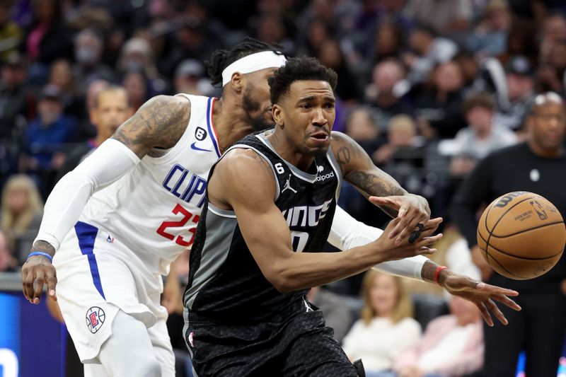 SACRAMENTO, CALIFORNIA - MARCH 03: Robert Covington #23 of the LA Clippers strips the ball from Malik Monk #0 of the Sacramento Kings at Golden 1 Center on March 03, 2023 in Sacramento, California. NOTE TO USER: User expressly acknowledges and agrees that, by downloading and or using this photograph, User is consenting to the terms and conditions of the Getty Images License Agreement.   (Photo by Ezra Shaw/Getty Images)