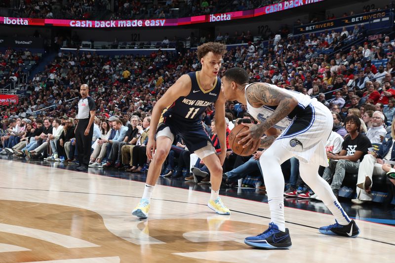 NEW ORLEANS, LA - APRIL 3:  Dyson Daniels #11 of the New Orleans Pelicans plays defense against Markelle Fultz #20 of the Orlando Magic on April 3, 2024 at the Smoothie King Center in New Orleans, Louisiana. NOTE TO USER: User expressly acknowledges and agrees that, by downloading and or using this Photograph, user is consenting to the terms and conditions of the Getty Images License Agreement. Mandatory Copyright Notice: Copyright 2024 NBAE (Photo by Layne Murdoch Jr./NBAE via Getty Images)