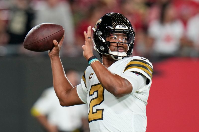 New Orleans Saints quarterback Jameis Winston (2) warms up before an NFL football game against the Tampa Bay Buccaneers in Tampa, Fla., Monday, Dec. 5, 2022. (AP Photo/Chris O'Meara)