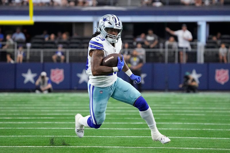 Dallas Cowboys running back Rico Dowdle runs with the ball during the first half of an NFL preseason football game against the Jacksonville Jaguars, Saturday, Aug. 12, 2023, in Arlington, Texas. (AP Photo/Sam Hodde)