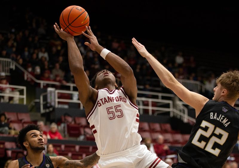 Feb 26, 2023; Stanford, California, USA; Stanford Cardinal forward Harrison Ingram (55) goes up for a shot between Washington Huskies defenders Jamal Bey (5) and Cole Bajema (22) during the first half at Maples Pavilion. Mandatory Credit: D. Ross Cameron-USA TODAY Sports