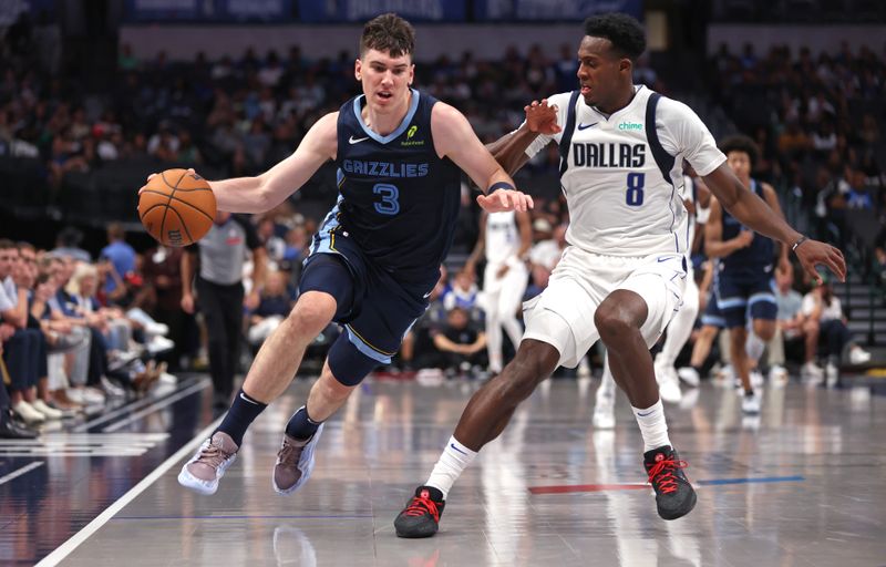 DALLAS, TX - OCTOBER 7: Jake LaRavia #3 of the Memphis Grizzlies drives against Olivier-Maxence Prosper #8 of the Dallas Mavericks in the second half of a preseason game at American Airlines Center on October 7, 2024 in Dallas, Texas. NOTE TO USER: User expressly acknowledges and agrees that, by downloading and or using this photograph, User is consenting to the terms and conditions of the Getty Images License Agreement. (Photo by Ron Jenkins/Getty Images)