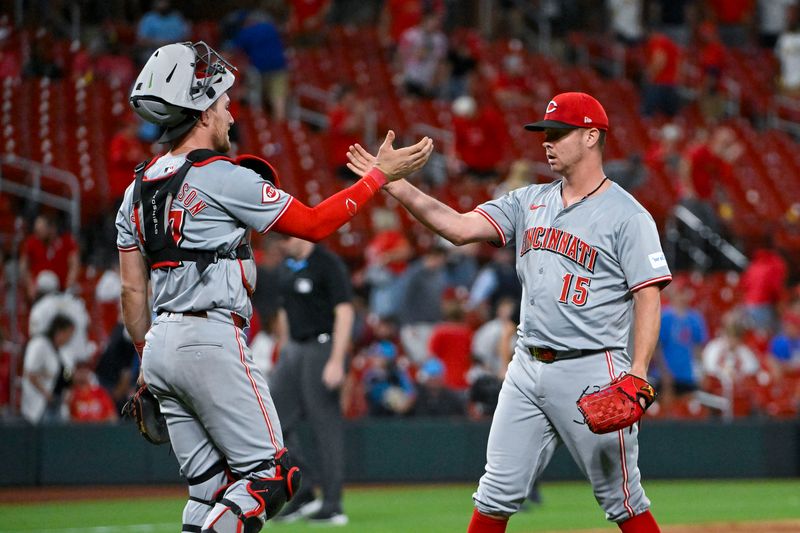 Sep 10, 2024; St. Louis, Missouri, USA;  Cincinnati Reds relief pitcher Emilio Pagan (15) and catcher Tyler Stephenson (37) celebrate after the Reds defeated the St. Louis Cardinals at Busch Stadium. Mandatory Credit: Jeff Curry-Imagn Images