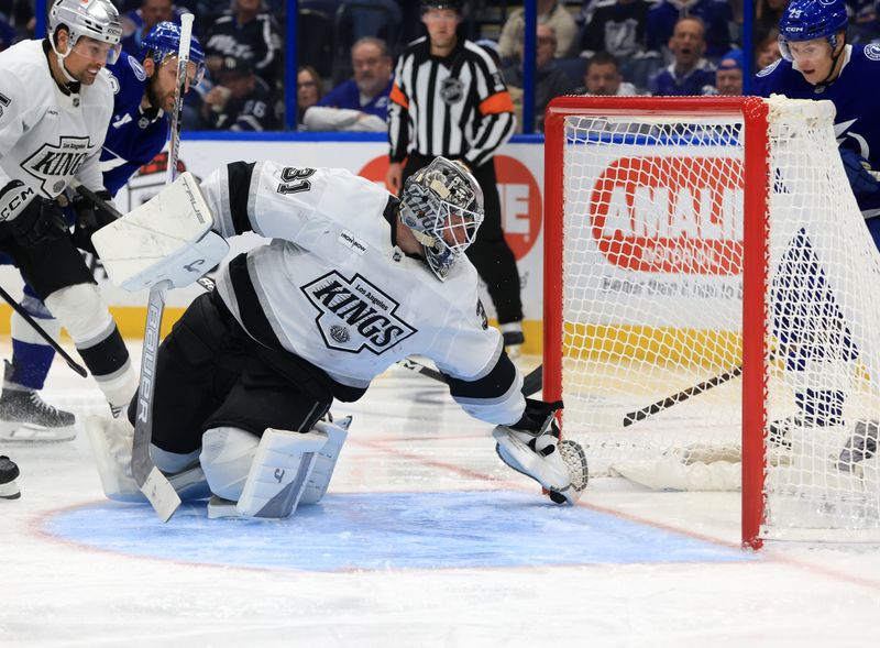 Dec 18, 2025; Tampa, Florida, USA; Los Angeles Kings goaltender Anton Forsberg (31) makes a save against the Tampa Bay Lightning during the third period at Benchmark International Arena. Mandatory Credit: Kim Klement Neitzel-Imagn Images