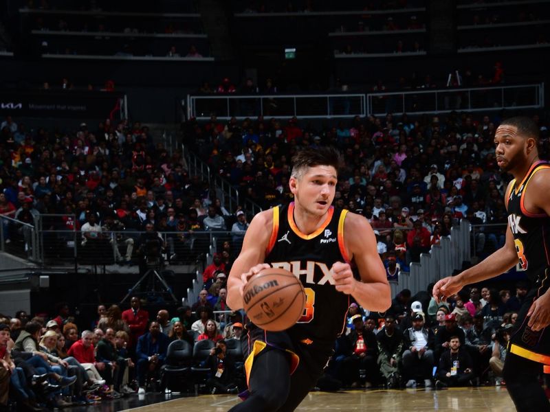 ATLANTA, GA - FEBRUARY 2: Grayson Allen #8 of the Phoenix Suns drives to the basket during the game against the Atlanta Hawks on February 2, 2024 at State Farm Arena in Atlanta, Georgia.  NOTE TO USER: User expressly acknowledges and agrees that, by downloading and/or using this Photograph, user is consenting to the terms and conditions of the Getty Images License Agreement. Mandatory Copyright Notice: Copyright 2024 NBAE (Photo by Scott Cunningham/NBAE via Getty Images)