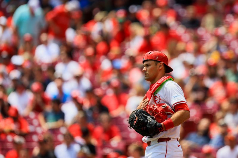 May 23, 2024; Cincinnati, Ohio, USA; Cincinnati Reds catcher Luke Maile (22) signals to starting pitcher Frankie Montas (not pictured) in the first inning against the San Diego Padres at Great American Ball Park. Mandatory Credit: Katie Stratman-USA TODAY Sports