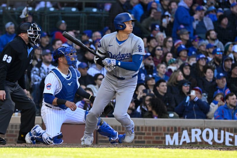 Apr 6, 2024; Chicago, Illinois, USA;  Los Angeles Dodgers two-way player Shohei Ohtani (17) singles during the fifth inning against the Chicago Cubs at Wrigley Field. Mandatory Credit: Matt Marton-USA TODAY Sports