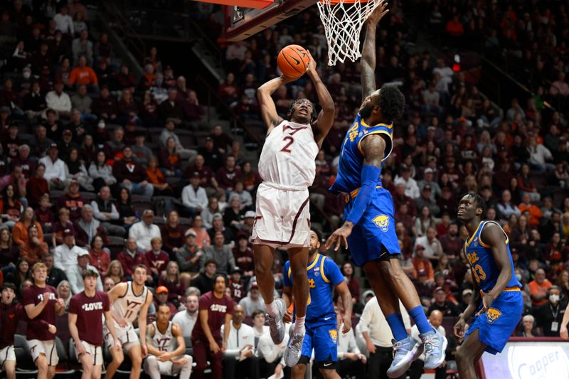 Feb 18, 2023; Blacksburg, Virginia, USA; Virginia Tech Hokies guard MJ Collins (2) drives to the basket against Pittsburgh Panthers guard Jamarius Burton (11) in the second half at Cassell Coliseum. Mandatory Credit: Lee Luther Jr.-USA TODAY Sports