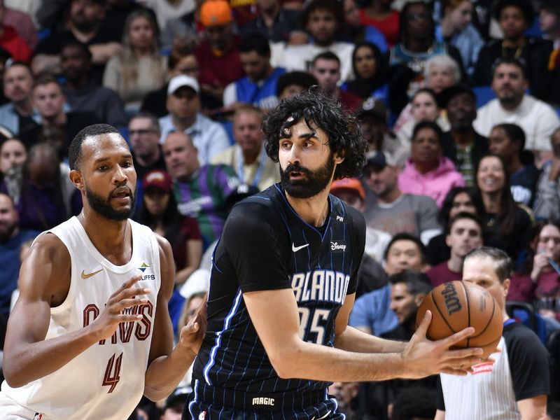 ORLANDO, FL - FEBRUARY 25:  Goga Bitadze #35 of the Orlando Magic looks to pass the ball during the game against the Cleveland Cavaliers on February 25, 2025 at Kia Center in Orlando, Florida. NOTE TO USER: User expressly acknowledges and agrees that, by downloading and or using this photograph, User is consenting to the terms and conditions of the Getty Images License Agreement. Mandatory Copyright Notice: Copyright 2025 NBAE (Photo by Fernando Medina/NBAE via Getty Images)