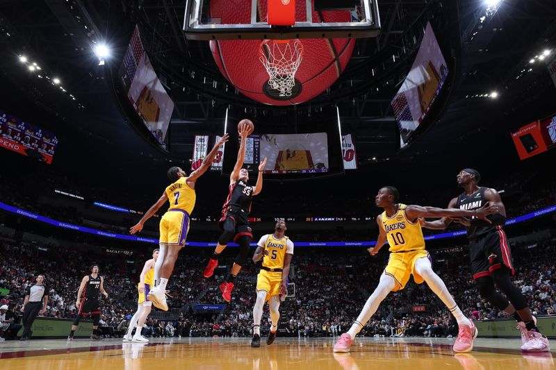 MIAMI, FL - DECEMBER 4:Duncan Robinson #55 of the Miami Heat drives to the basket during the game against the Los Angeles Lakers  on December 4, 2024 at Kaseya Center in Miami, Florida. NOTE TO USER: User expressly acknowledges and agrees that, by downloading and or using this Photograph, user is consenting to the terms and conditions of the Getty Images License Agreement. Mandatory Copyright Notice: Copyright 2024 NBAE (Photo by Joe Murphy/NBAE via Getty Images)