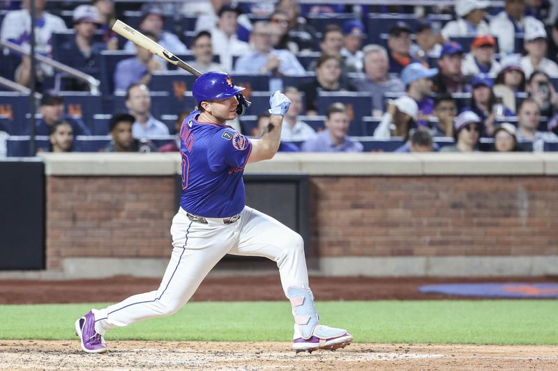 Jun 26, 2025; New York City, New York, USA;  New York Mets first baseman Pete Alonso (20) hits an RBI single in the fifth inning against the Atlanta Braves at Citi Field. Mandatory Credit: Wendell Cruz-Imagn Images