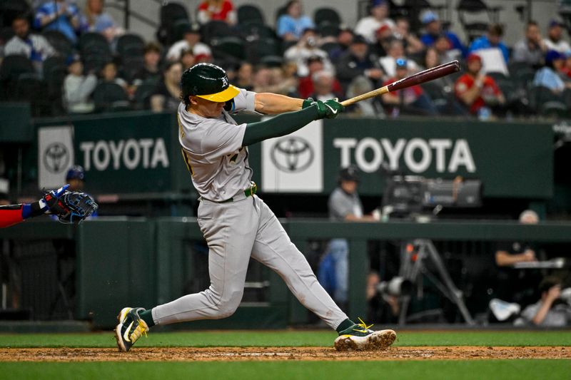 Apr 10, 2024; Arlington, Texas, USA; Oakland Athletics second baseman Zack Gelof (20) hits a home run against the Texas Rangers during the eighth inning at Globe Life Field. Mandatory Credit: Jerome Miron-USA TODAY Sports