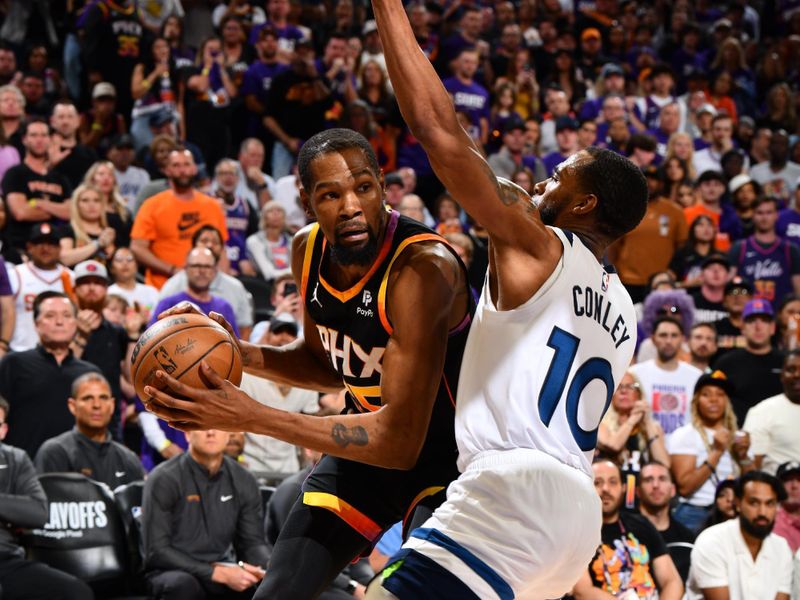 PHOENIX, AZ - APRIL 4: Kevin Durant #35 of the Phoenix Suns handles the ball during the game against the Minnesota Timberwolves during Round 1 Game 4 of the 2024 NBA Playoffs on April 4, 2023 at Footprint Center in Phoenix, Arizona. NOTE TO USER: User expressly acknowledges and agrees that, by downloading and or using this photograph, user is consenting to the terms and conditions of the Getty Images License Agreement. Mandatory Copyright Notice: Copyright 2024 NBAE (Photo by Barry Gossage/NBAE via Getty Images)