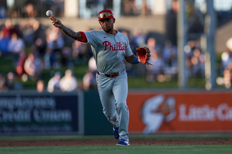 Mar 19, 2024; Lakeland, Florida, USA;  Philadelphia Phillies shortstop Edmundo Sosa (33) throws to first for an out against the Detroit Tigers in the fourth inning at Publix Field at Joker Marchant Stadium. Mandatory Credit: Nathan Ray Seebeck-USA TODAY Sports