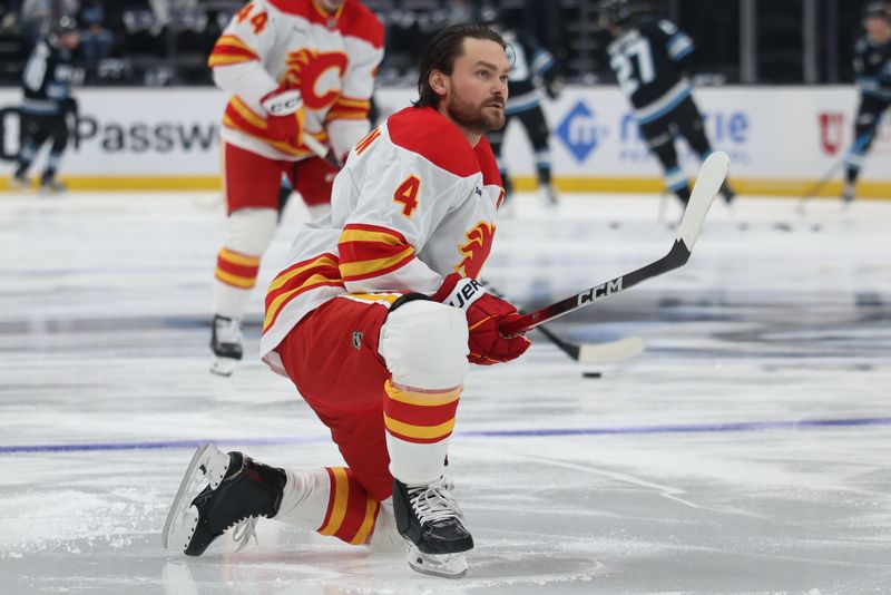 Oct 15, 2025; Salt Lake City, Utah, USA; Calgary Flames defenseman Rasmus Andersson (4) warms up before a game against the Utah Mammoth at Delta Center. Mandatory Credit: Rob Gray-Imagn Images