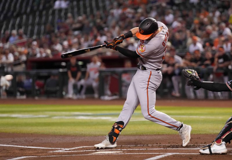 Sep 1, 2023; Phoenix, Arizona, USA; Baltimore Orioles first baseman Ryan O'Hearn (32) hits an RBI single against the Arizona Diamondbacks during the first inning at Chase Field. Mandatory Credit: Joe Camporeale-USA TODAY Sports