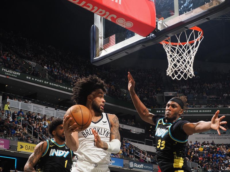 INDIANAPOLIS, IN - MARCH 16: Trendon Watford #9 of the Brooklyn Nets looks to pass the ball during the game against the Indiana Pacers on March 16, 2024 at Gainbridge Fieldhouse in Indianapolis, Indiana. NOTE TO USER: User expressly acknowledges and agrees that, by downloading and or using this Photograph, user is consenting to the terms and conditions of the Getty Images License Agreement. Mandatory Copyright Notice: Copyright 2024 NBAE (Photo by Ron Hoskins/NBAE via Getty Images)