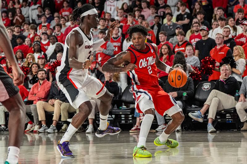 Jan 14, 2026; Athens, Georgia, USA; Mississippi Rebels guard AJ Storr (2) dribbles against Georgia Bulldogs center Somto Cyril (2) during the second  half at Stegeman Coliseum. Mandatory Credit: Dale Zanine-Imagn Images
