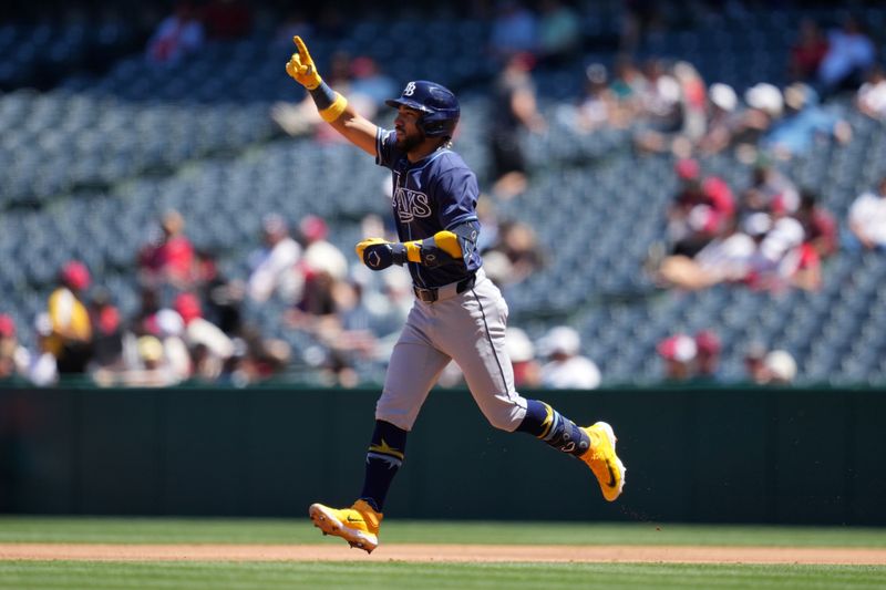 Apr 10, 2024; Anaheim, California, USA; Tampa Bay Rays shortstop Jose Caballero (7) celebrates after hitting a home run in the second inning against the Los Angeles Angels at Angel Stadium. Mandatory Credit: Kirby Lee-USA TODAY Sports