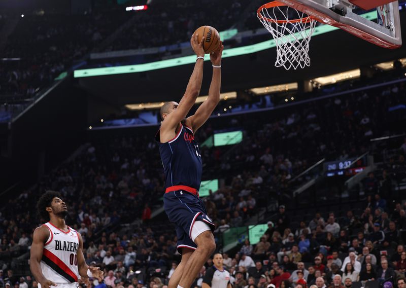 INGLEWOOD, CALIFORNIA - OCTOBER 30: Nicolas Batum #33 of the LA Clippers scores in front of Scoot Henderson #00 of the Portland Trail Blazers during the first half at Intuit Dome on October 30, 2024 in Inglewood, California. (Photo by Harry How/Getty Images). NOTE TO USER: User expressly acknowledges and agrees that, by downloading and or using this photograph, User is consenting to the terms and conditions of the Getty Images License Agreement. (Photo by Harry How/Getty Images)