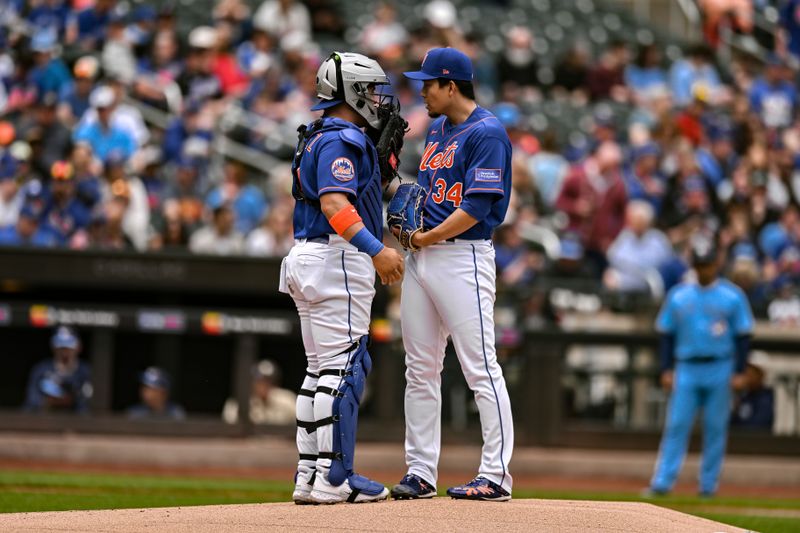 Jun 4, 2023; New York City, New York, USA; New York Mets catcher Francisco Alvarez (4) and starting pitcher Kodai Senga (34) talk during the first inning against the Toronto Blue Jays at Citi Field. Mandatory Credit: John Jones-USA TODAY Sports