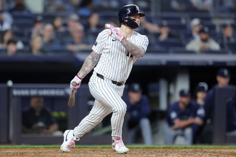 May 20, 2024; Bronx, New York, USA; New York Yankees left fielder Alex Verdugo (24) follows through on an RBI single against the Seattle Mariners during the fifth inning at Yankee Stadium. Mandatory Credit: Brad Penner-USA TODAY Sports