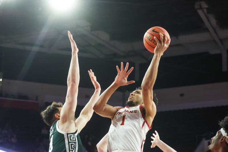 Feb 1, 2025; Los Angeles, California, USA;  USC Trojans guard Desmond Claude (1) shoots the ball against the Michigan State Spartans during the first half at Galen Center. Mandatory Credit: William Navarro-Imagn Images