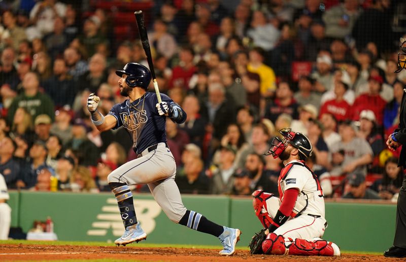 May 13, 2024; Boston, Massachusetts, USA; Tampa Bay Rays shortstop Jose Caballero (7) hits a double against the Boston Red Sox in the forth inning at Fenway Park. Mandatory Credit: David Butler II-USA TODAY Sports