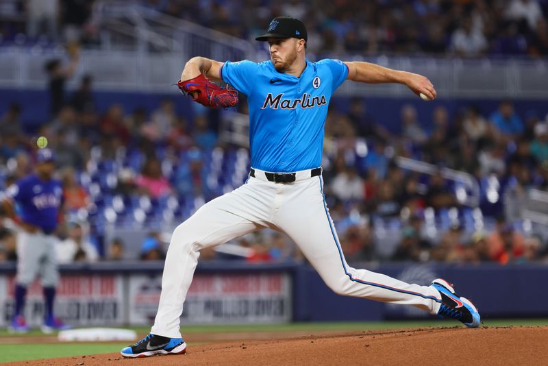 Jun 2, 2024; Miami, Florida, USA;  Miami Marlins starting pitcher Trevor Rogers (28) delivers a pitch against the Texas Rangers during the first inning at loanDepot Park. Mandatory Credit: Sam Navarro-USA TODAY Sports