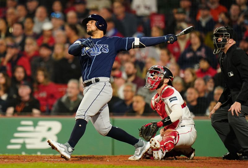 Sep 26, 2023; Boston, Massachusetts, USA; Tampa Bay Rays catcher Rene Pinto (50) hits a home run against the Boston Red Sox in the third inning at Fenway Park. Mandatory Credit: David Butler II-USA TODAY Sports