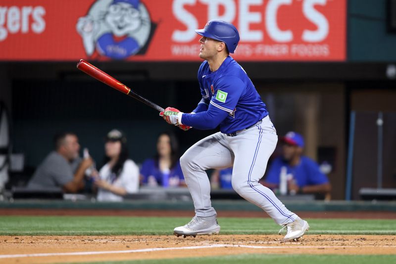 May 26, 2025; Arlington, Texas, USA; Toronto Blue Jays outfielder Daulton Varsho (5) hits a double during the fourth inning against the Texas Rangers at Globe Life Field. Mandatory Credit: Tim Heitman-Imagn Images