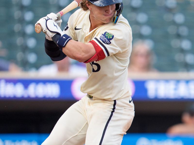 Sep 14, 2025; Minneapolis, Minnesota, USA; Minnesota Twins second base Luke Keaschall (15) is hit by a pitch from Arizona Diamondbacks pitcher Kyle Backhus (43) in the ninth inning at Target Field. Mandatory Credit: Matt Blewett-Imagn Images