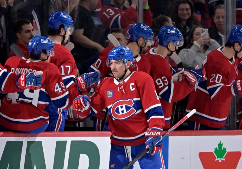 Nov 20, 2025; Montreal, Quebec, CAN; Montreal Canadiens forward Nick Suzuki (14) celebrates with teammates after scoring a goal against the Washington Capitals during the second period at the Bell Centre. Mandatory Credit: Eric Bolte-Imagn Images