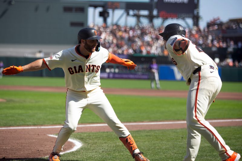 Sep 27, 2025; San Francisco, California, USA; San Francisco Giants second baseman Casey Schmitt (left) and teammate Matt Chapman celebrate Schmitt’s three-run home run against the Colorado Rockies during the second inning at Oracle Park. Mandatory Credit: D. Ross Cameron-Imagn Images