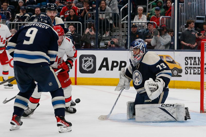 Apr 16, 2024; Columbus, Ohio, USA; Columbus Blue Jackets defenseman Ivan Provorov (9) and Carolina Hurricanes right wing Stefan Noesen (23) battle for the rebound during the third period at Nationwide Arena. Mandatory Credit: Russell LaBounty-USA TODAY Sports