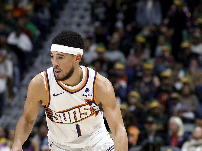 NEW ORLEANS, LOUISIANA - JANUARY 19: Devin Booker #1 of the Phoenix Suns dribbles the ball down court during the third quarter of an NBA game against the New Orleans Pelicans at Smoothie King Center on January 19, 2024 in New Orleans, Louisiana. NOTE TO USER: User expressly acknowledges and agrees that, by downloading and or using this photograph, User is consenting to the terms and conditions of the Getty Images License Agreement. (Photo by Sean Gardner/Getty Images)