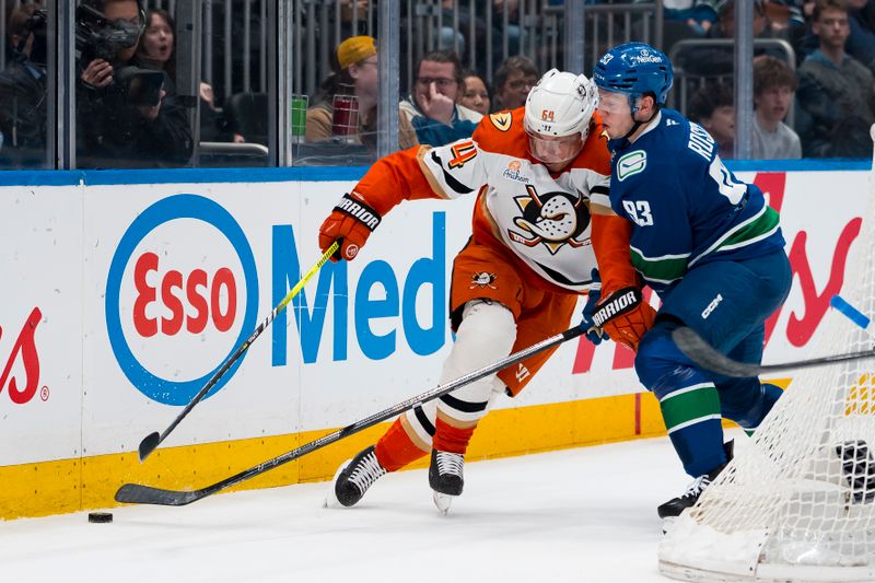 Mar 24, 2026; Vancouver, British Columbia, CAN; Vancouver Canucks forward Marco Rossi (93) checks Anaheim Ducks forward Mikael Granlund (64) in the first period at Rogers Arena. Mandatory Credit: Bob Frid-Imagn Images