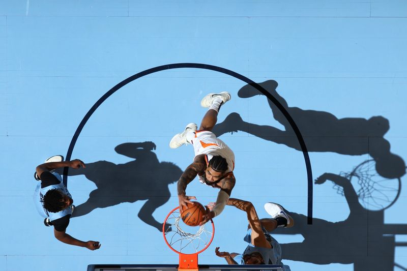 MEMPHIS, TN - FEBRUARY 25: Nick Richards #2 of the Phoenix Suns dunks the ball during the game against the Memphis Grizzlies on February 25, 2025 at FedExForum in Memphis, Tennessee. NOTE TO USER: User expressly acknowledges and agrees that, by downloading and or using this photograph, User is consenting to the terms and conditions of the Getty Images License Agreement. Mandatory Copyright Notice: Copyright 2025 NBAE (Photo by Joe Murphy/NBAE via Getty Images)