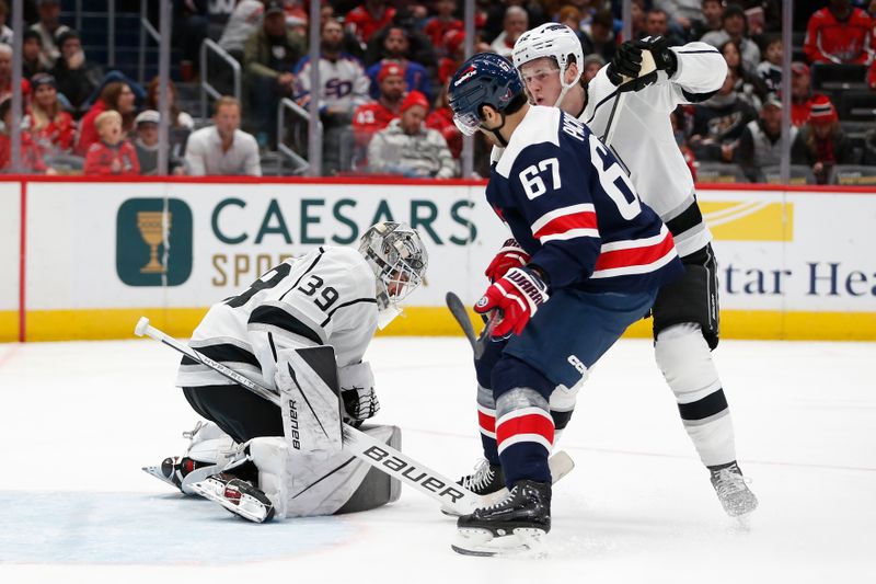 Jan 7, 2024; Washington, District of Columbia, USA; Los Angeles Kings goaltender Cam Talbot (39) makes a save in front of Washington Capitals left wing Max Pacioretty (67) and Kings defenseman Brandt Clarke (92) during the second period at Capital One Arena. Mandatory Credit: Amber Searls-USA TODAY Sports